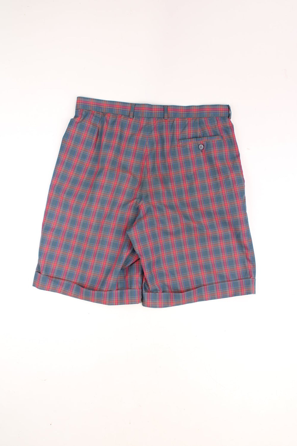 Vintage Lacoste Tartan Shorts in a red, blue and green colourway, and has the logo embroidered on the front. 