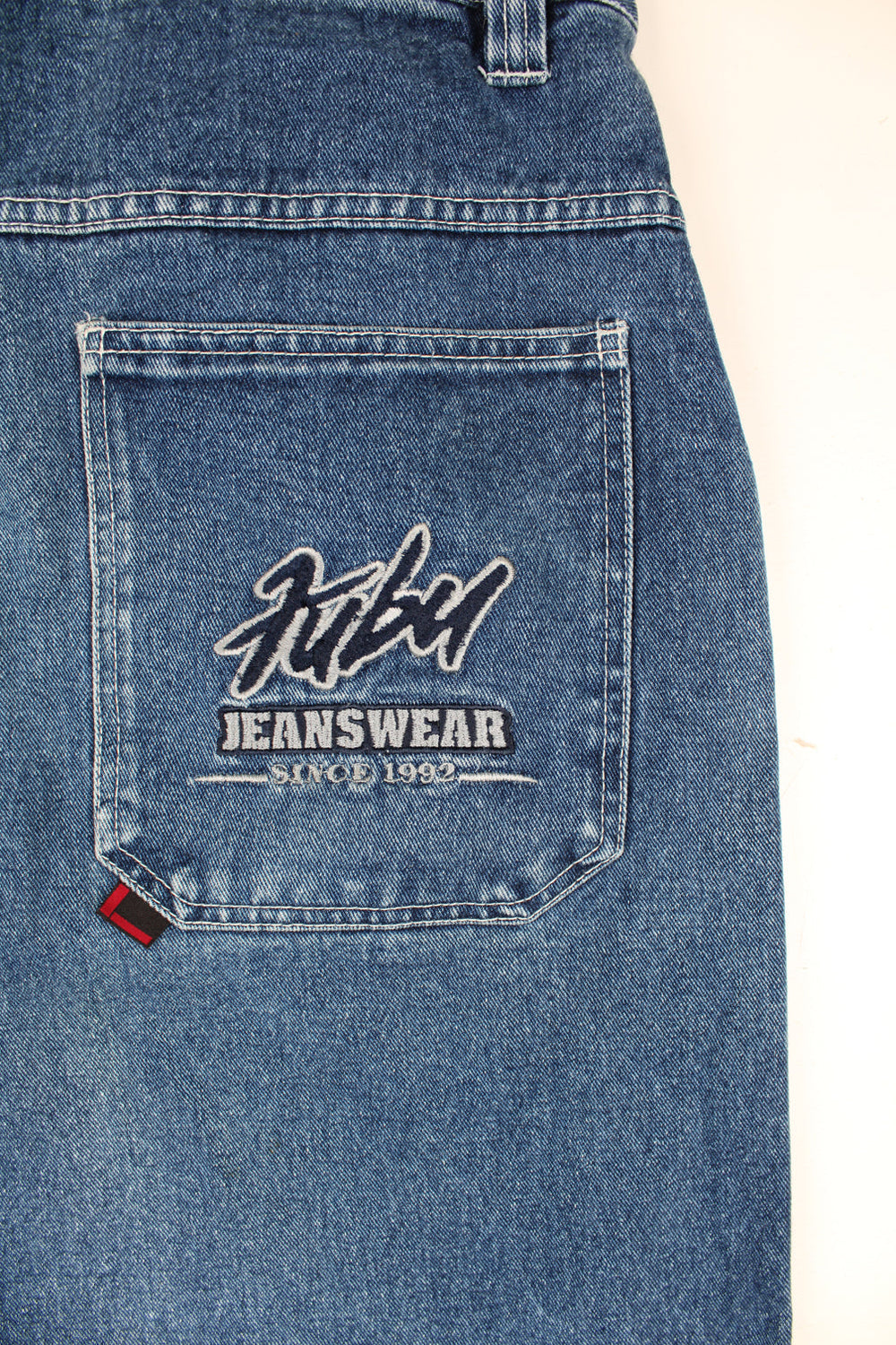 Vintage 90's style Fubu Jeanswear jorts with embroidered spell-out logo on the front and back pocket