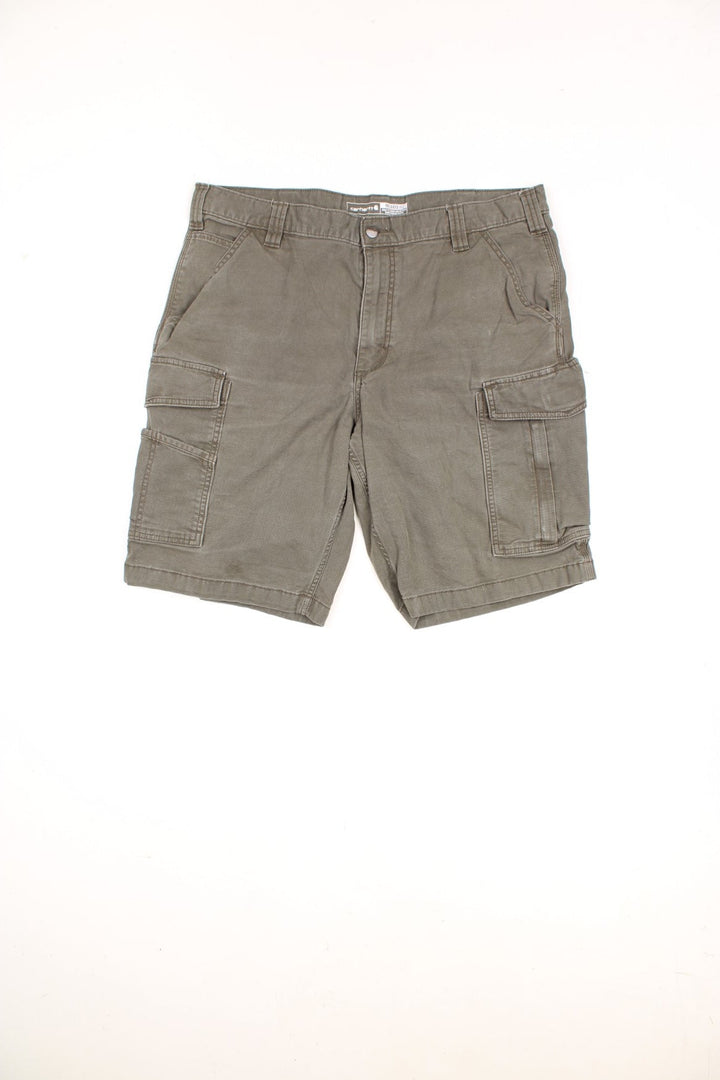 Carhartt Cargo Shorts in a khaki green colourway, has multiple pockets, and the logo embroidered on the back.