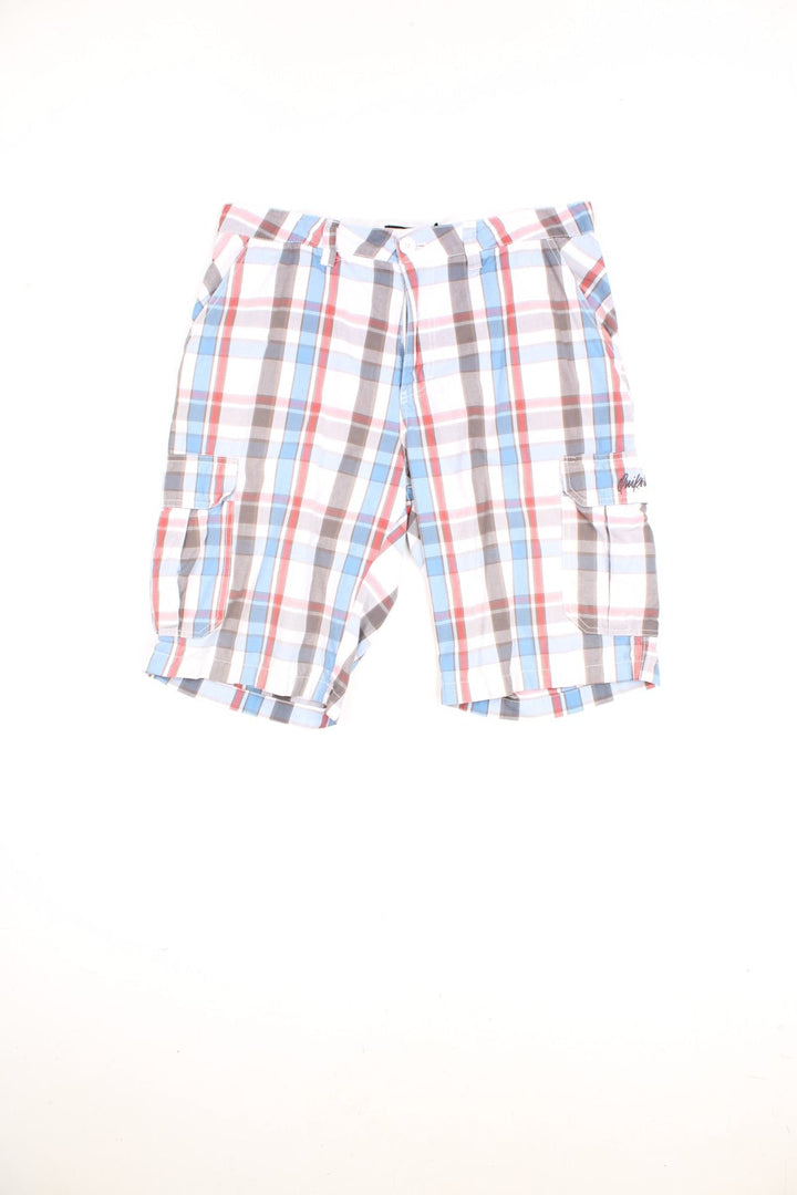 Quiksilver Shorts in a white, blue and red checkered colourway, has multiple pockets, and the logo embroidered on the front and back. 