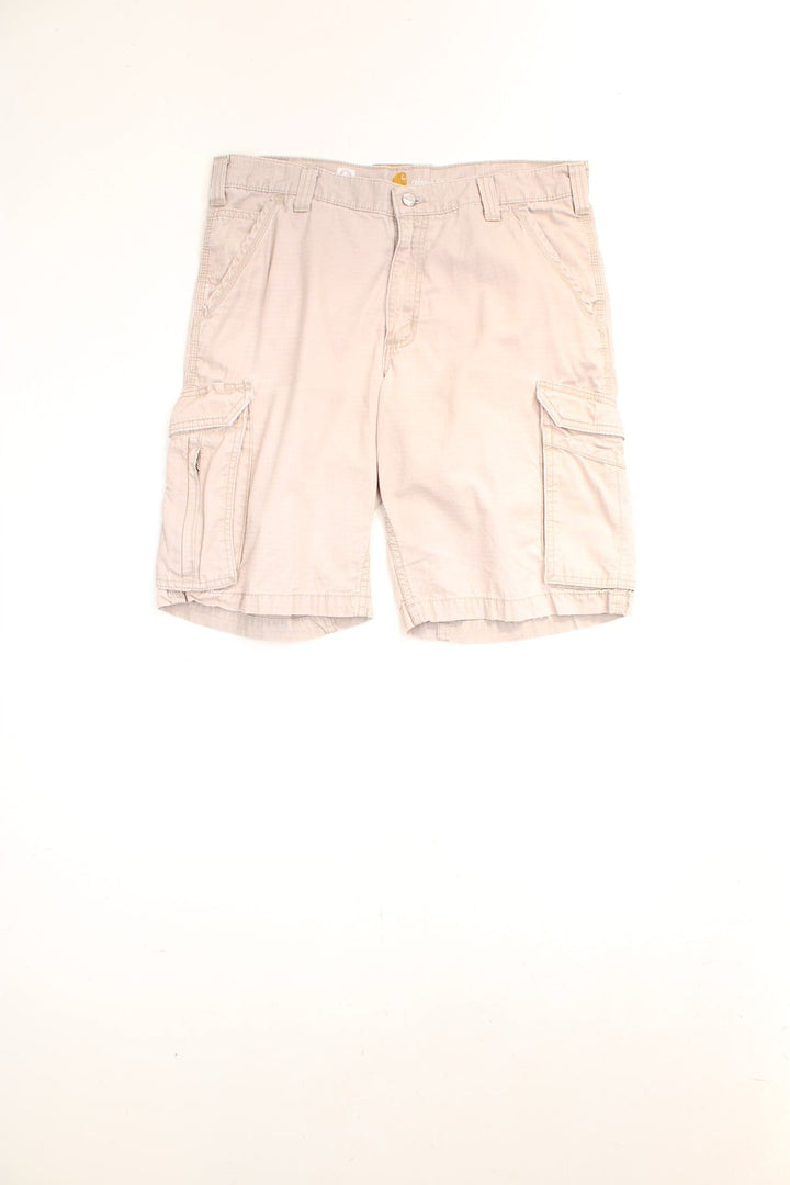 Carhartt Cargo Shorts in a tanned colourway, has multiple pockets and the logo embroidered on the back. 