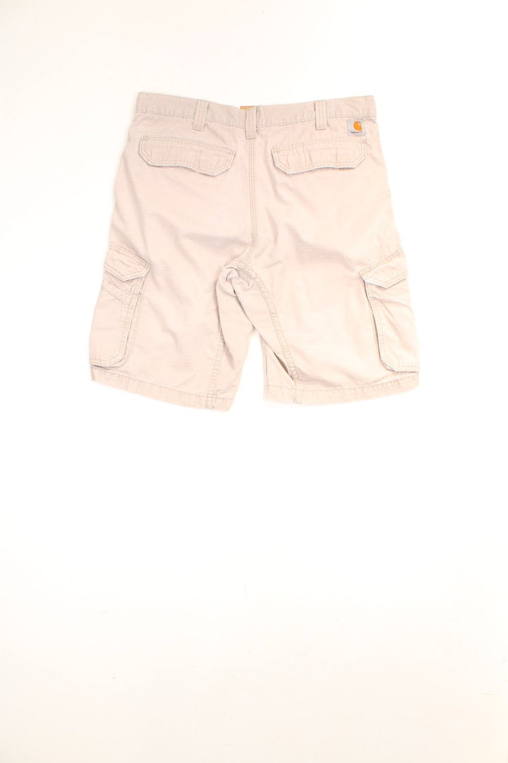 Carhartt Cargo Shorts in a tanned colourway, has multiple pockets and the logo embroidered on the back. 