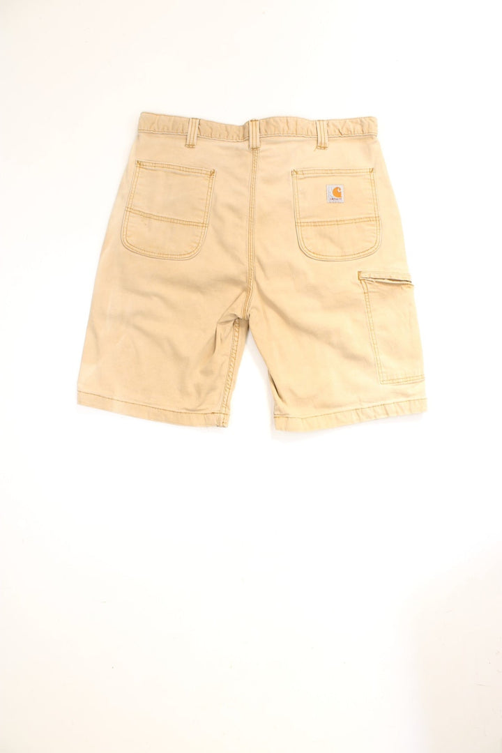 Carhartt Carpenter Shorts in a tanned colourway, has multiple pockets and the logo embroidered on the back. 