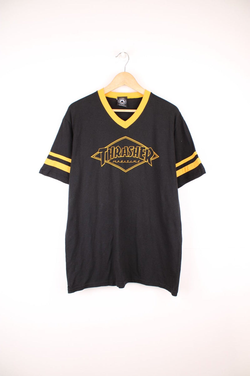 Thrasher Magazine Diamand spell out logo T-Shirt with yellow striped sleeves.