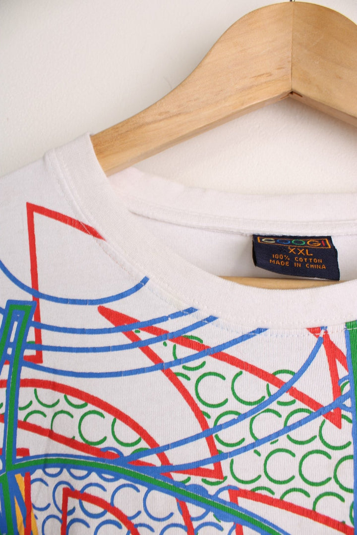 Coogi T-Shirt with multicoloured all over print and embroidered spell out logo.