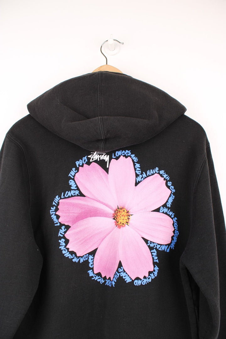 Stussy Cosmos Hoodie with graphic flower print on the chest and back bordered by poetic script.