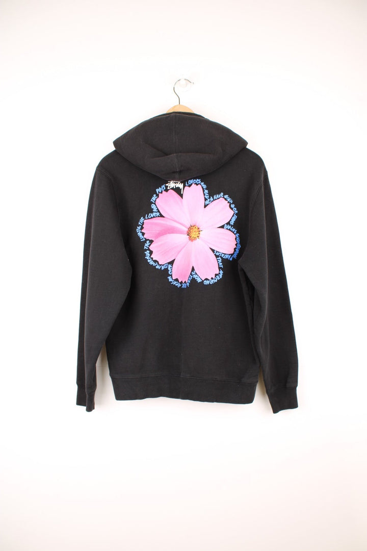 Stussy Cosmos Hoodie with graphic flower print on the chest and back bordered by poetic script.