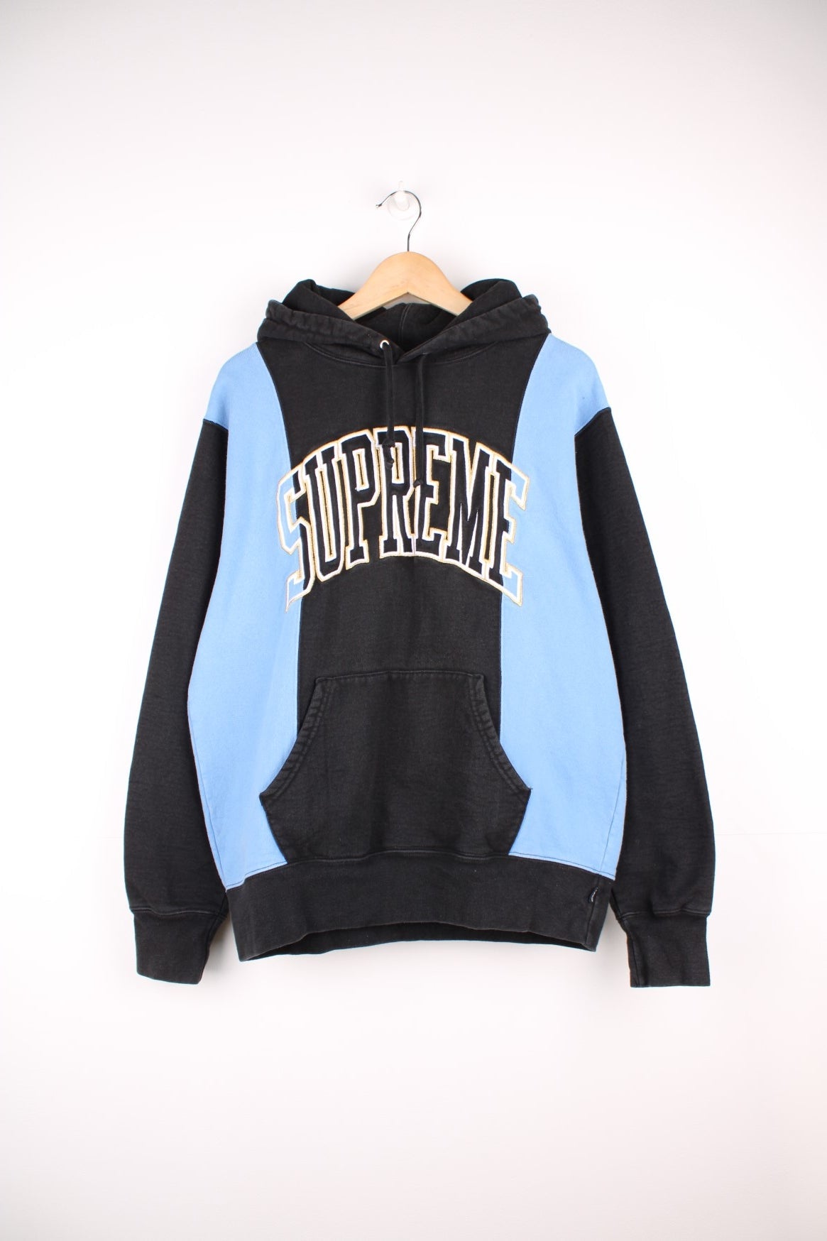 Supreme paneled Arc hoodie in a blue and black colourway with spell out logo across the chest. 