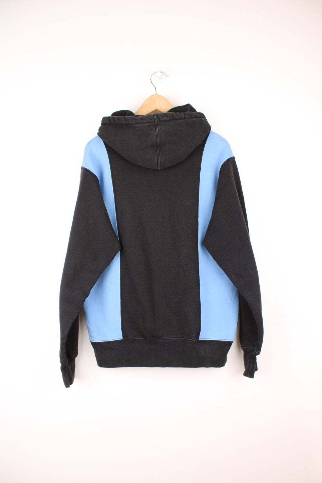 Supreme paneled Arc hoodie in a blue and black colourway with spell out logo across the chest. 