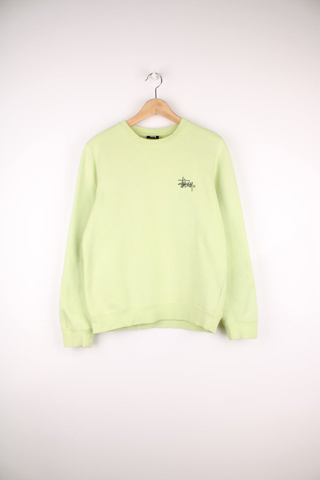 Lime green stussy crewneck sweatshirt with printed spell-out logo on the chest and back