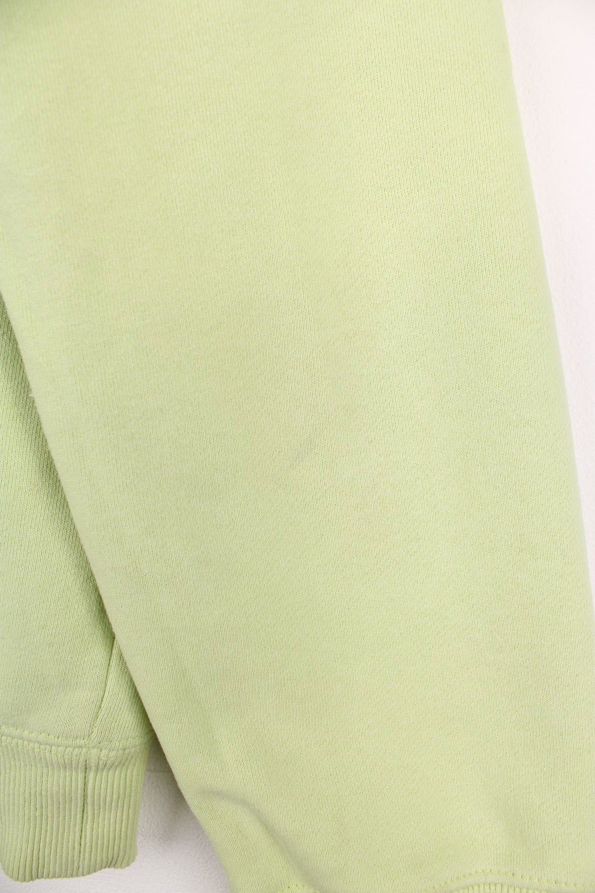 Lime green stussy crewneck sweatshirt with printed spell-out logo on the chest and back