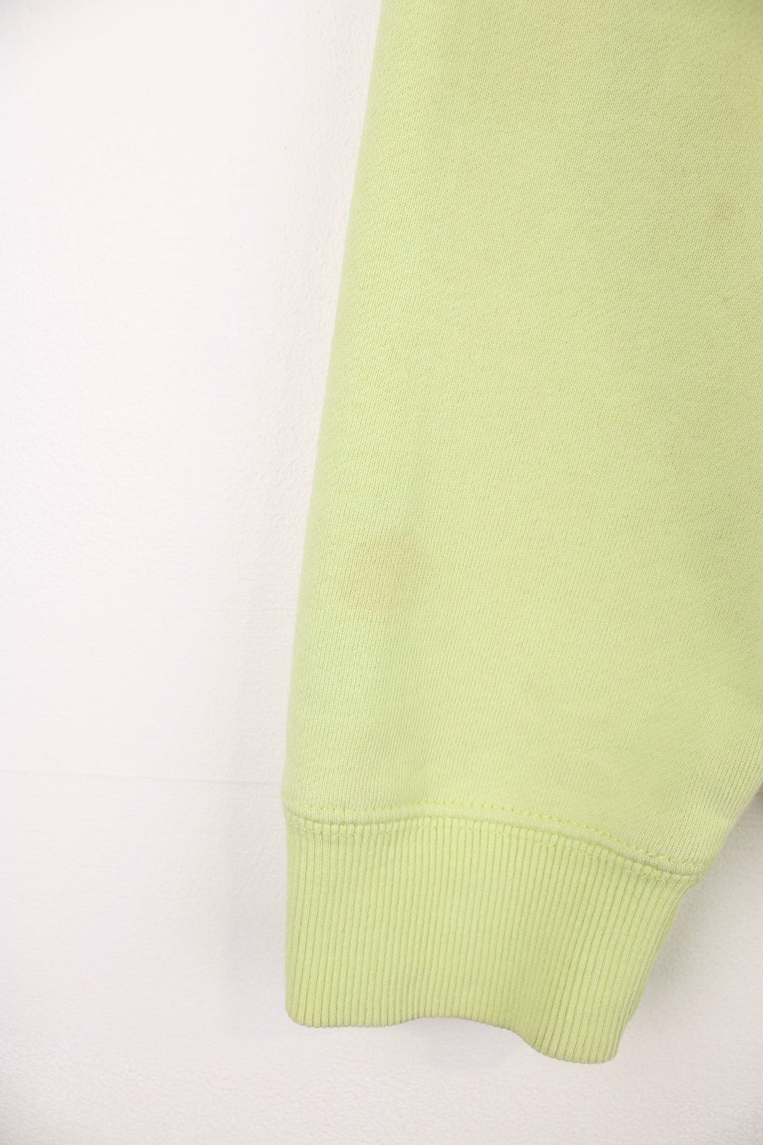 Lime green stussy crewneck sweatshirt with printed spell-out logo on the chest and back