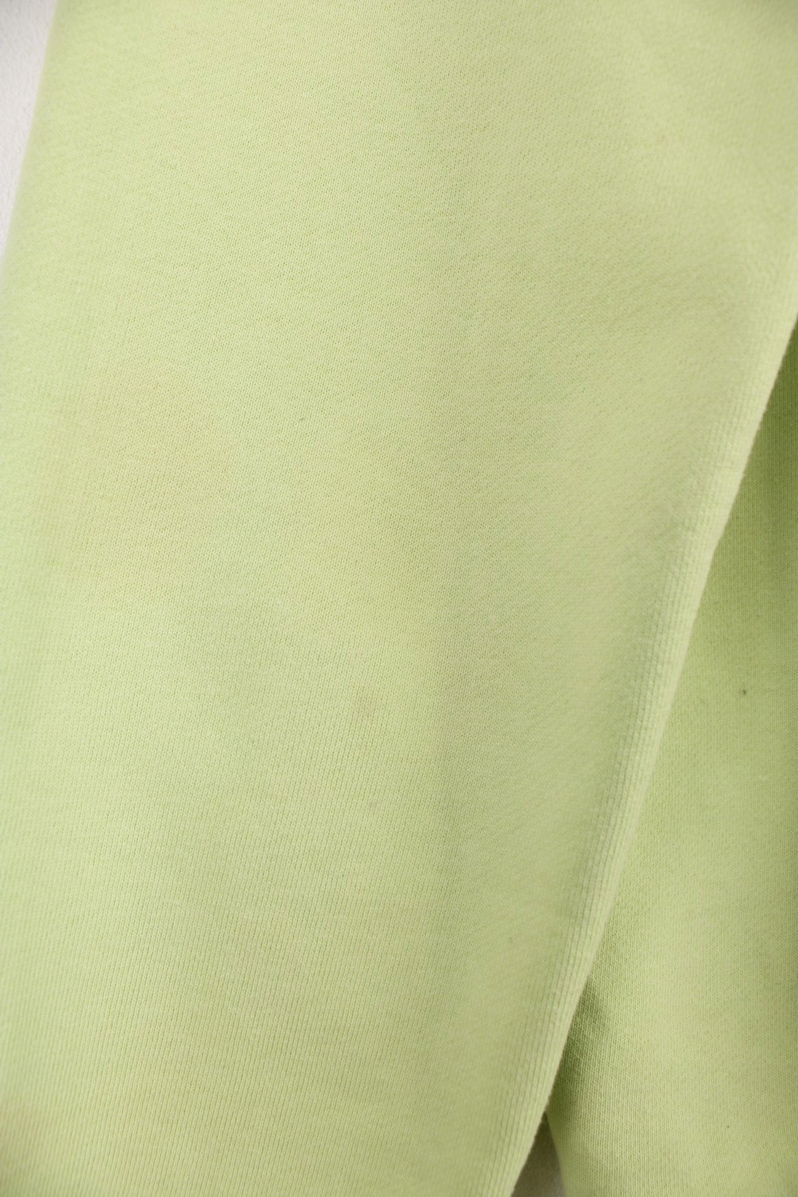 Lime green stussy crewneck sweatshirt with printed spell-out logo on the chest and back