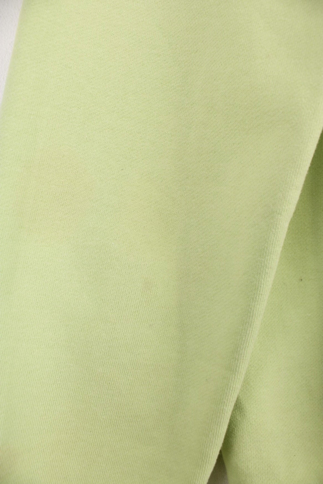 Lime green stussy crewneck sweatshirt with printed spell-out logo on the chest and back