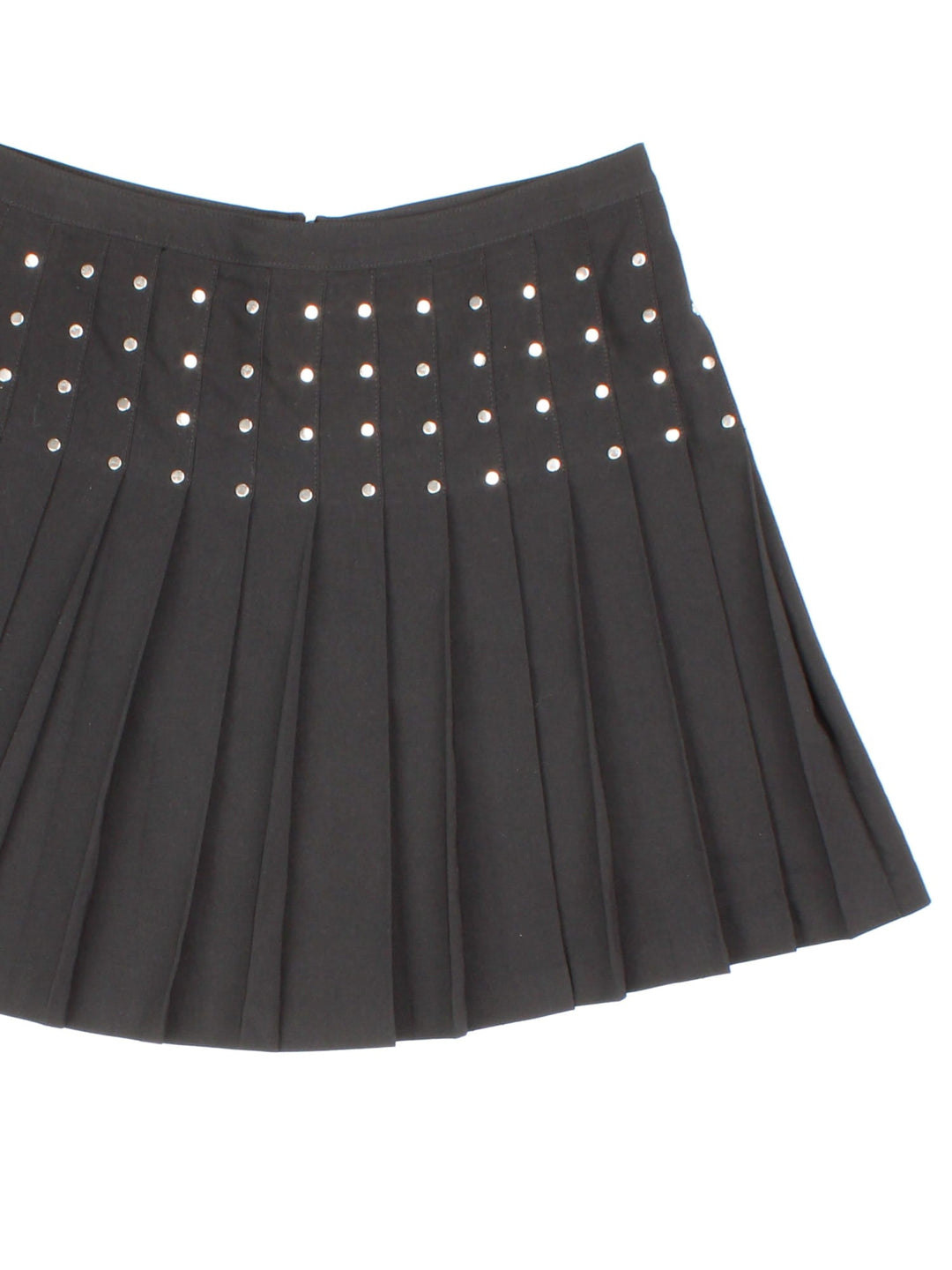 Y2K pleated mini skirt in black with silver stud detailing and zip closure.