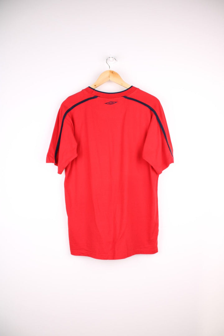 Vintage Umbro T-Shirt in a red colourway with an embroidered logo on the front