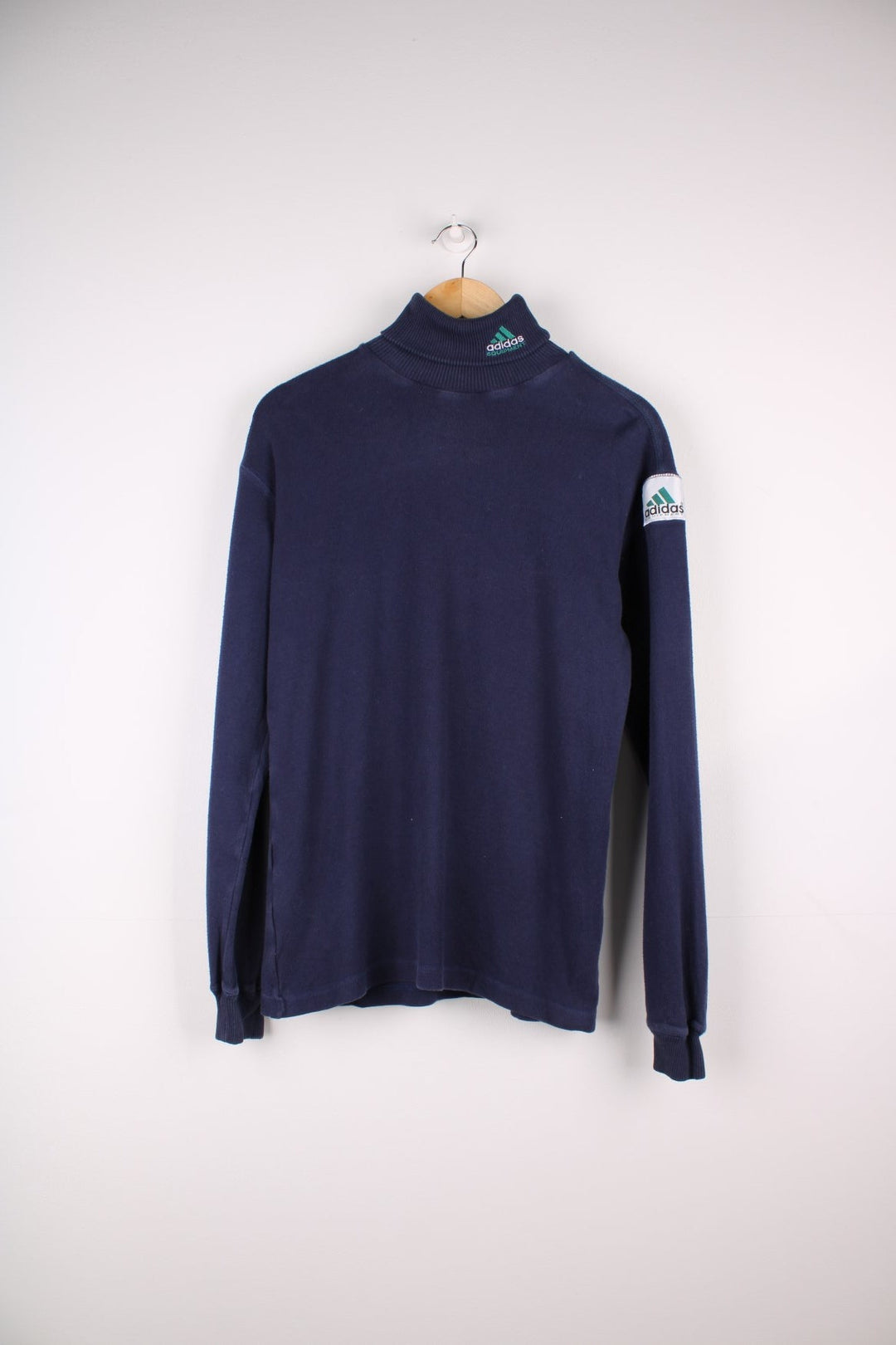 1990s Adidas Equipment lightweight turtleneck sweater in a navy blue colourway with the logo embroidered on the collar and a patch sewn into the arm.