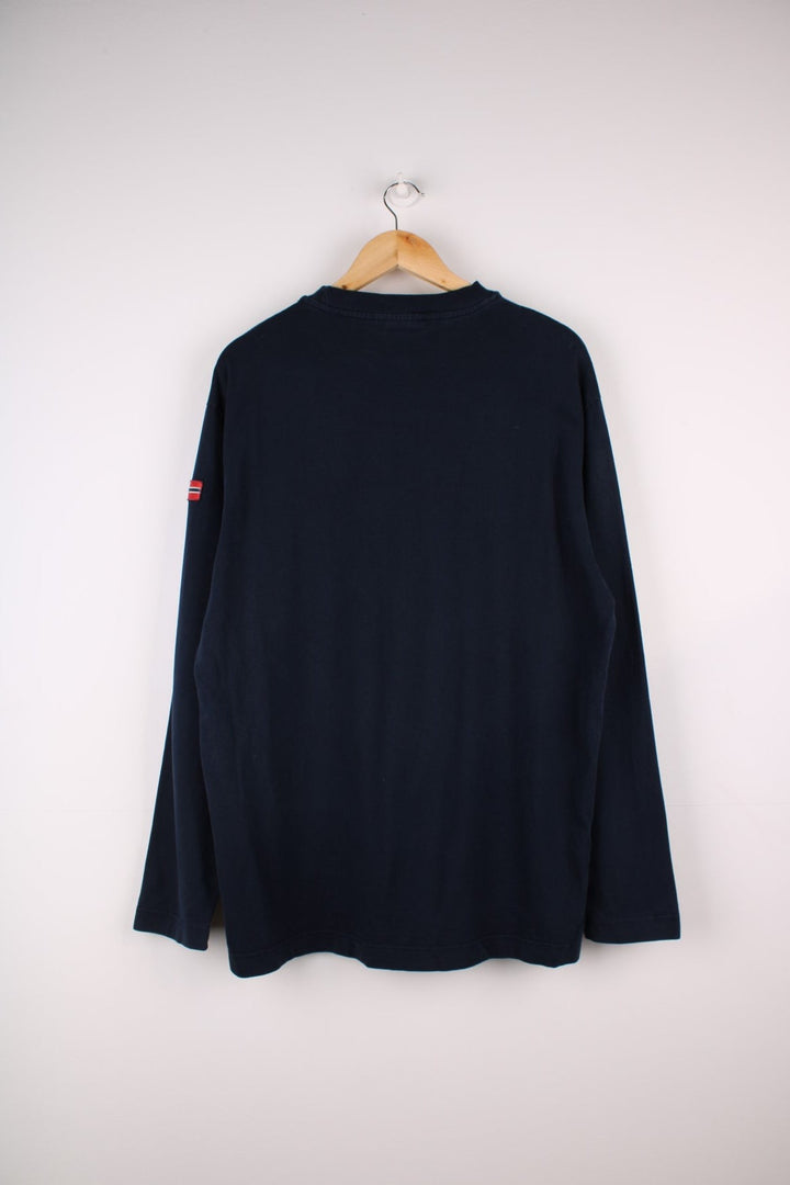 Napapijri long sleeve T-Shirt in a navyblue colourway with a front patch pocket, stiched logo and a Norwegian flag stitched on the arm.