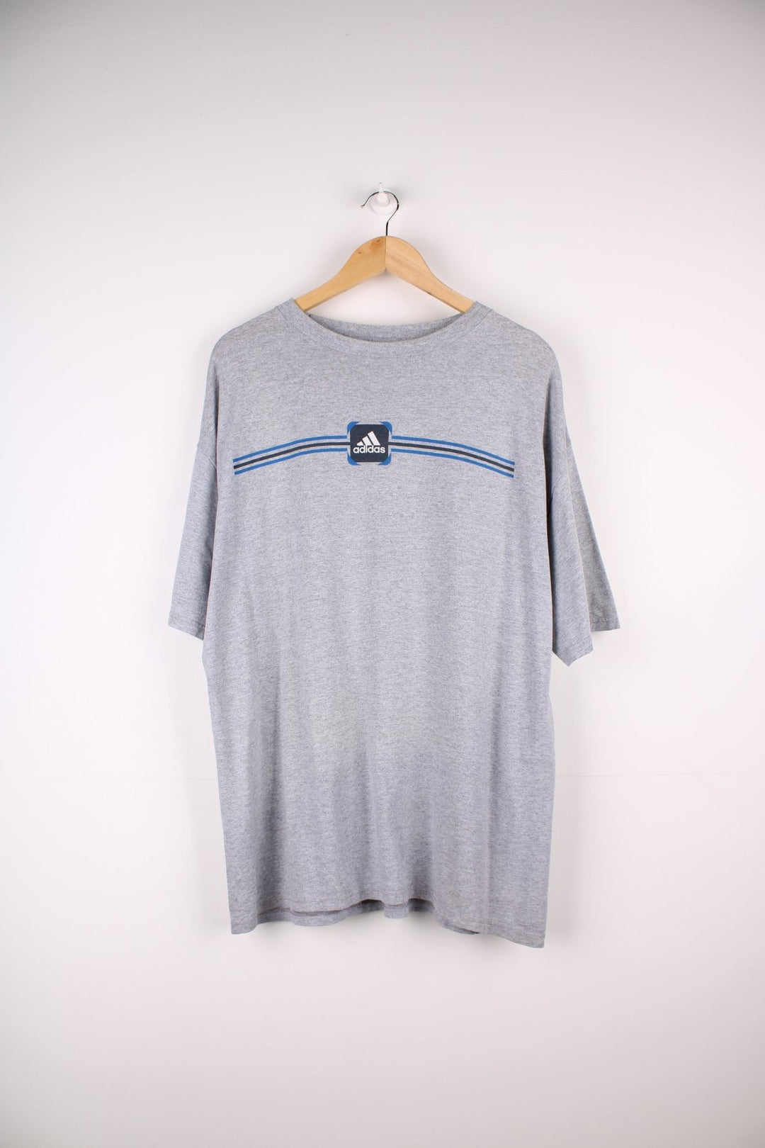 Vintage Early 2000s Adidas T-Shirt in a grey colourway a graphic printed on the front..