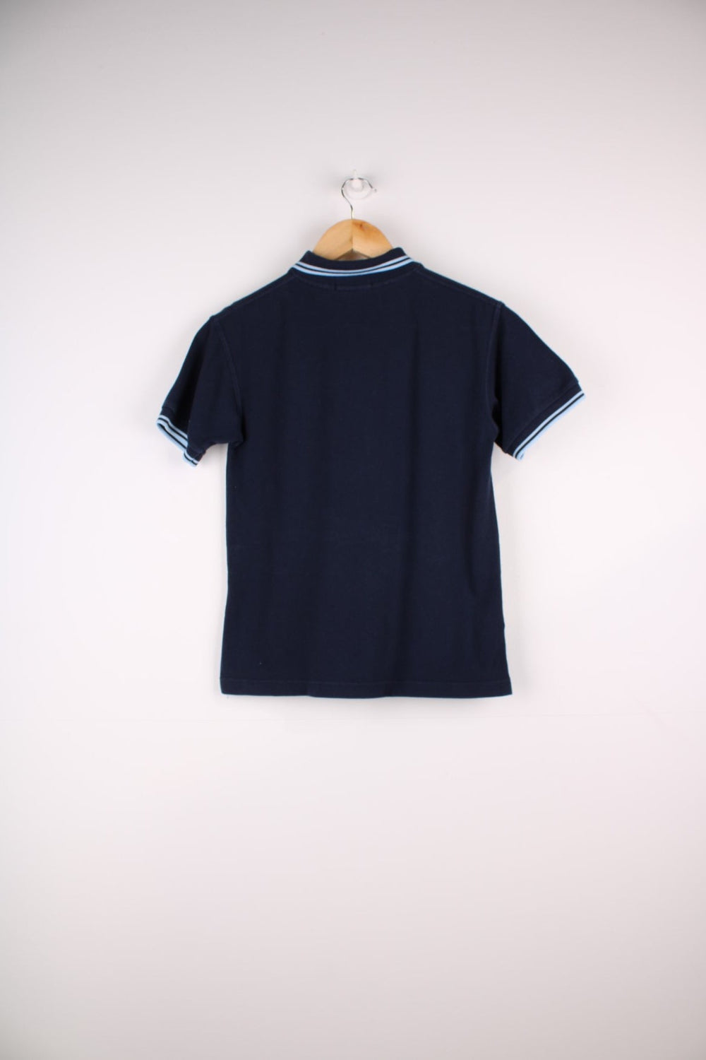 1980s Fred Perry Polo shirt in a navy blue colourway with the logo embroidered on the front. Two stripes on the collar and sleeves.