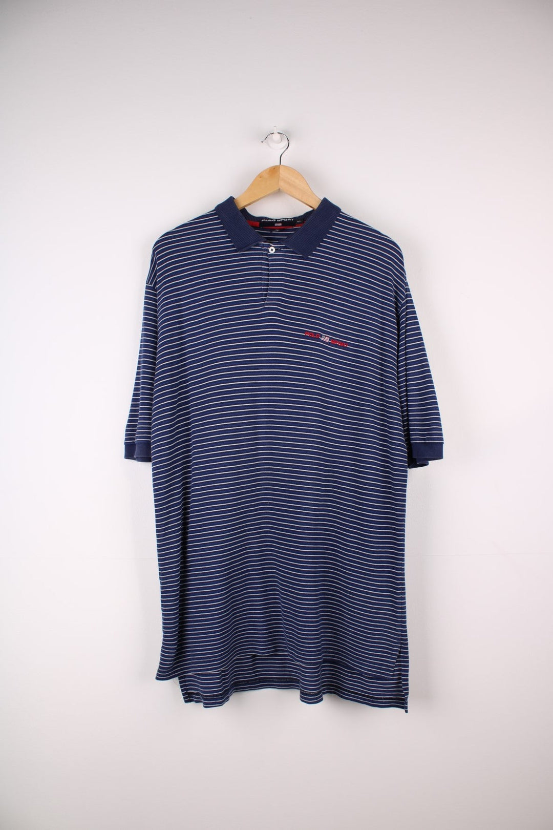 Ralph Lauren Polo Shirt in a navy blue and white stripe. The logo is embroidered on the front. 