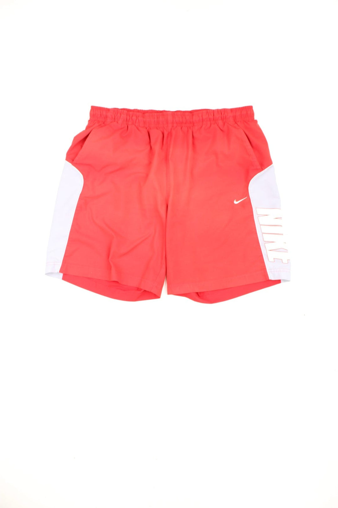 Red Nike drawstring swim shorts with embroidered logo and printed logo down the leg.