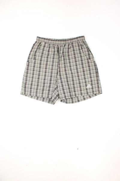 Vintage Adidas checked shorts in khaki green with drawstring waist and embroidered logo on the leg.