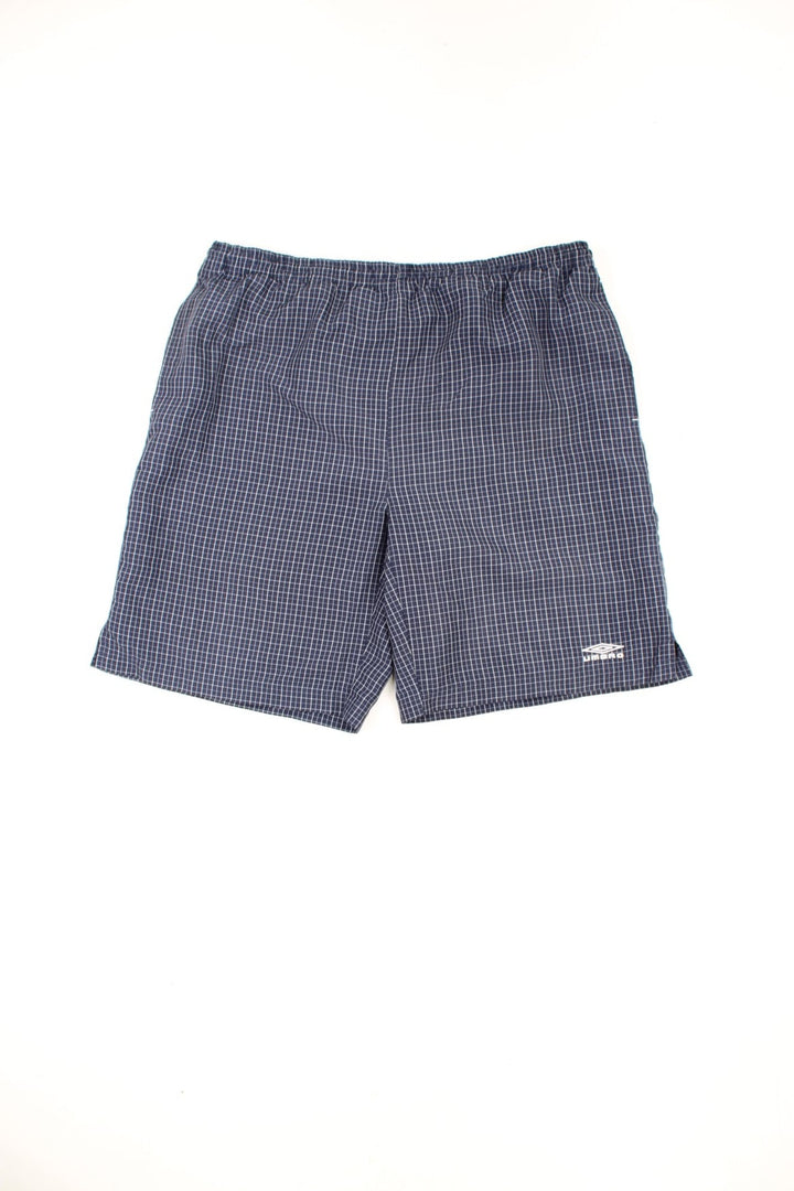 Blue and white Umbro shorts with drawstring waist and embroidered logo on the leg.