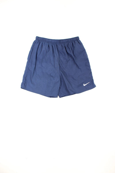 Vintage Nike shorts with elasticated drawstring waist, embroidered logo on the front and printed logo on the back.