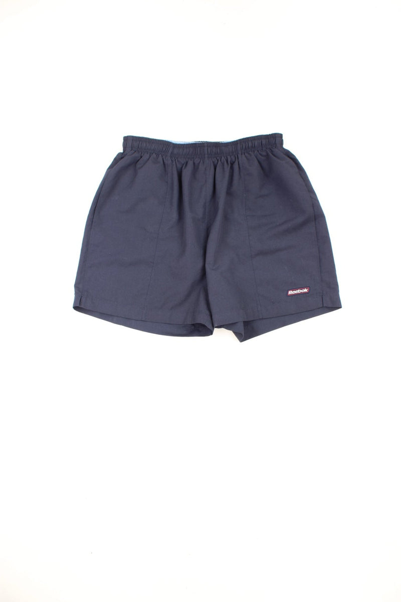 Reebok swim shorts with elasticated drawstring waist and embroidered logo.