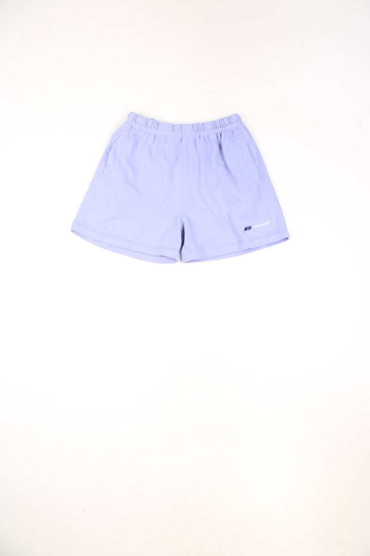 Purple Reebok shorts with elasticated drawstring waist and embroidered logo.