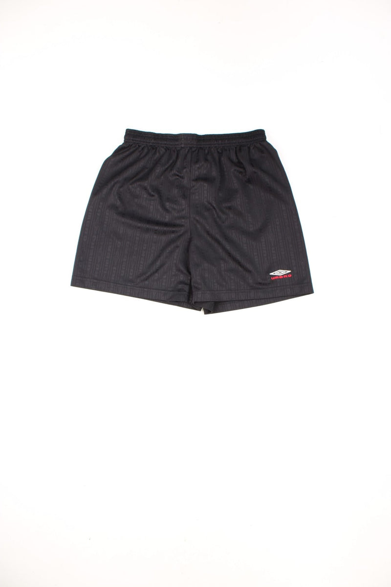 Black Umbro football shorts with elasticated drawstring waist and embroidered logo.