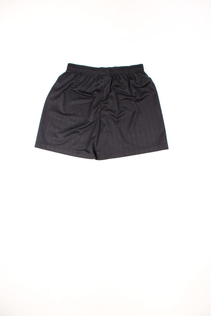 Black Umbro football shorts with elasticated drawstring waist and embroidered logo.