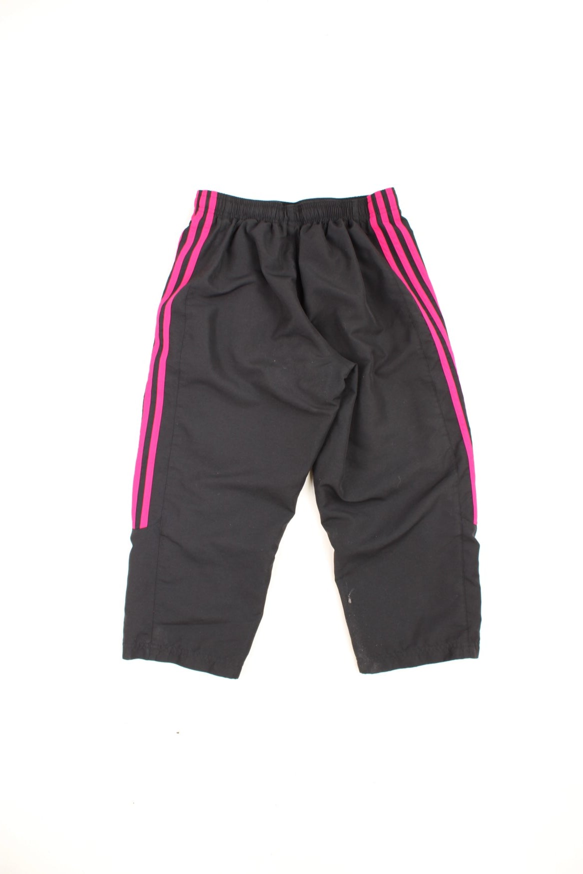 Black and pink Adidas 3/4 length tracksuit bottoms with embroidered logo and signature three stripes down each leg.