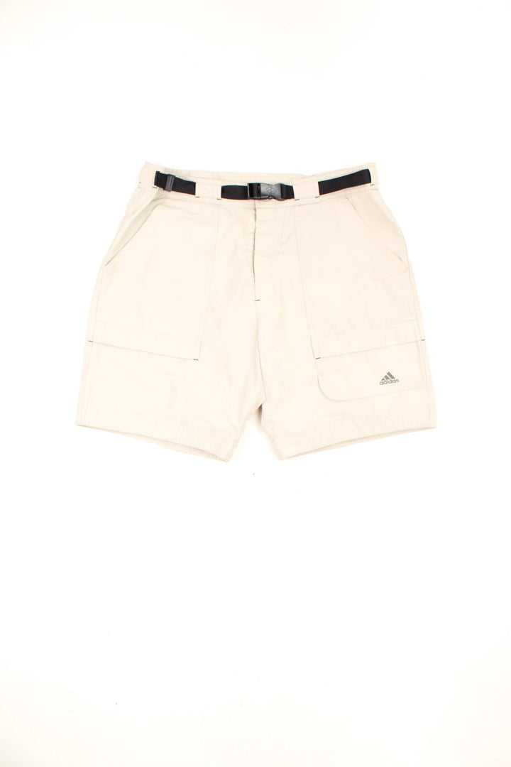 Beige Adidas cargo style shorts with multiple pockets, embroidered logo and attached belt.