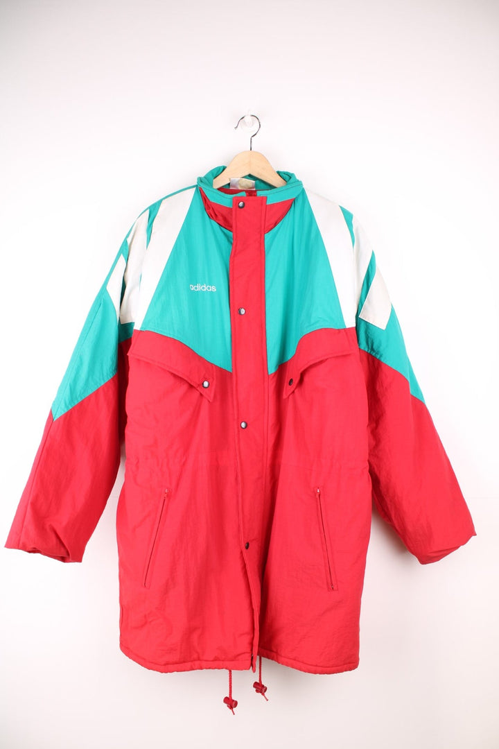 1992/93 Liverpool FC Adidas Bench Coat in a red, green and white colourway, insulated lining, multiple pockets, and has the spell out logo on the front and back. 