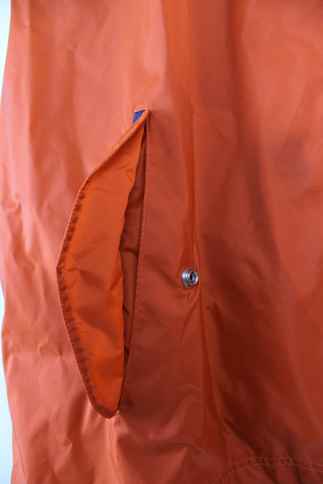 Vintage Nike lightweight windbreaker jacket in orange, blue and white. Features embroidered logo on the chest, printed logo on the back and a pack away hood.