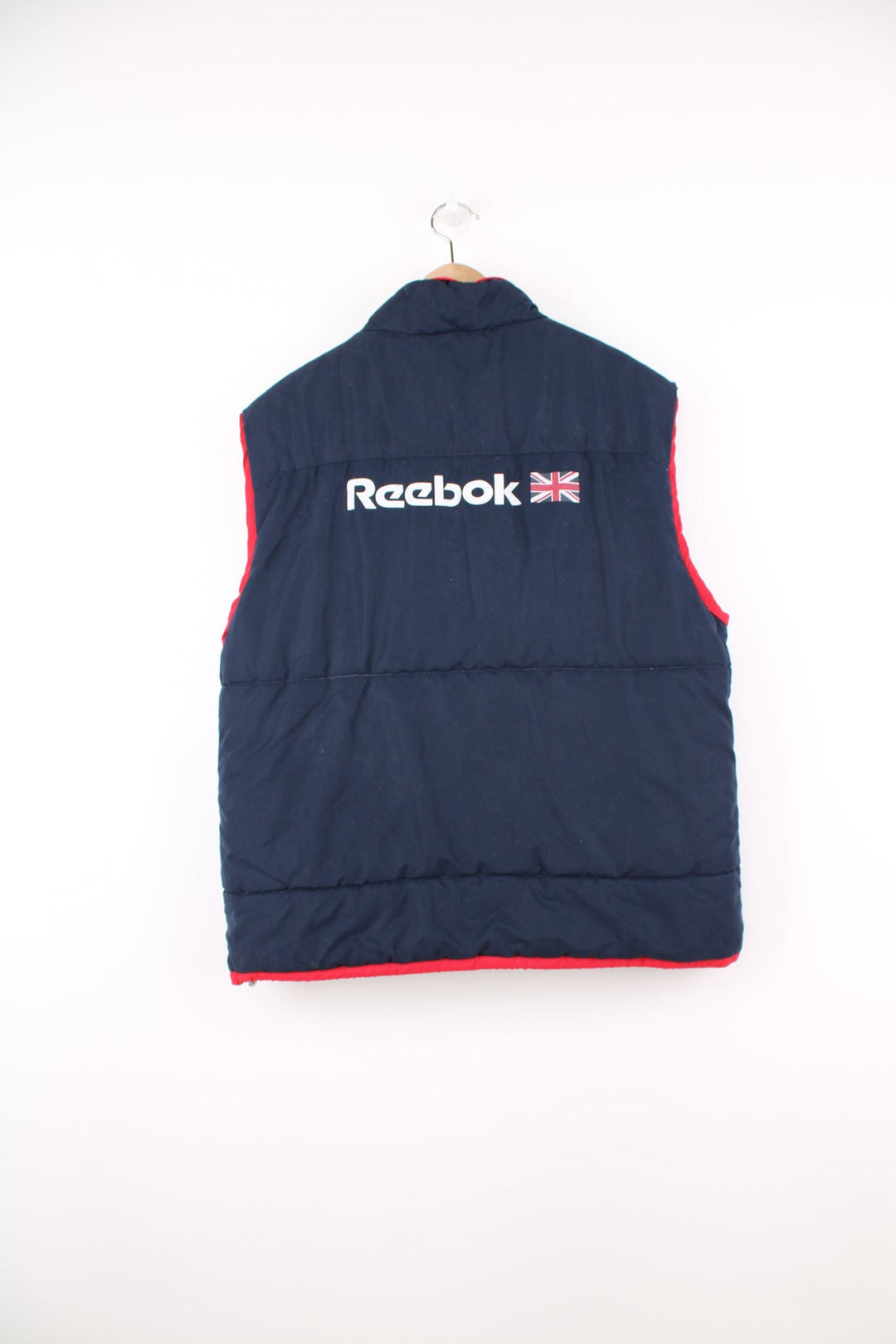 Reebok Classic blue and red gilet featuring embroidered logo on the chest and printed logo across the back.