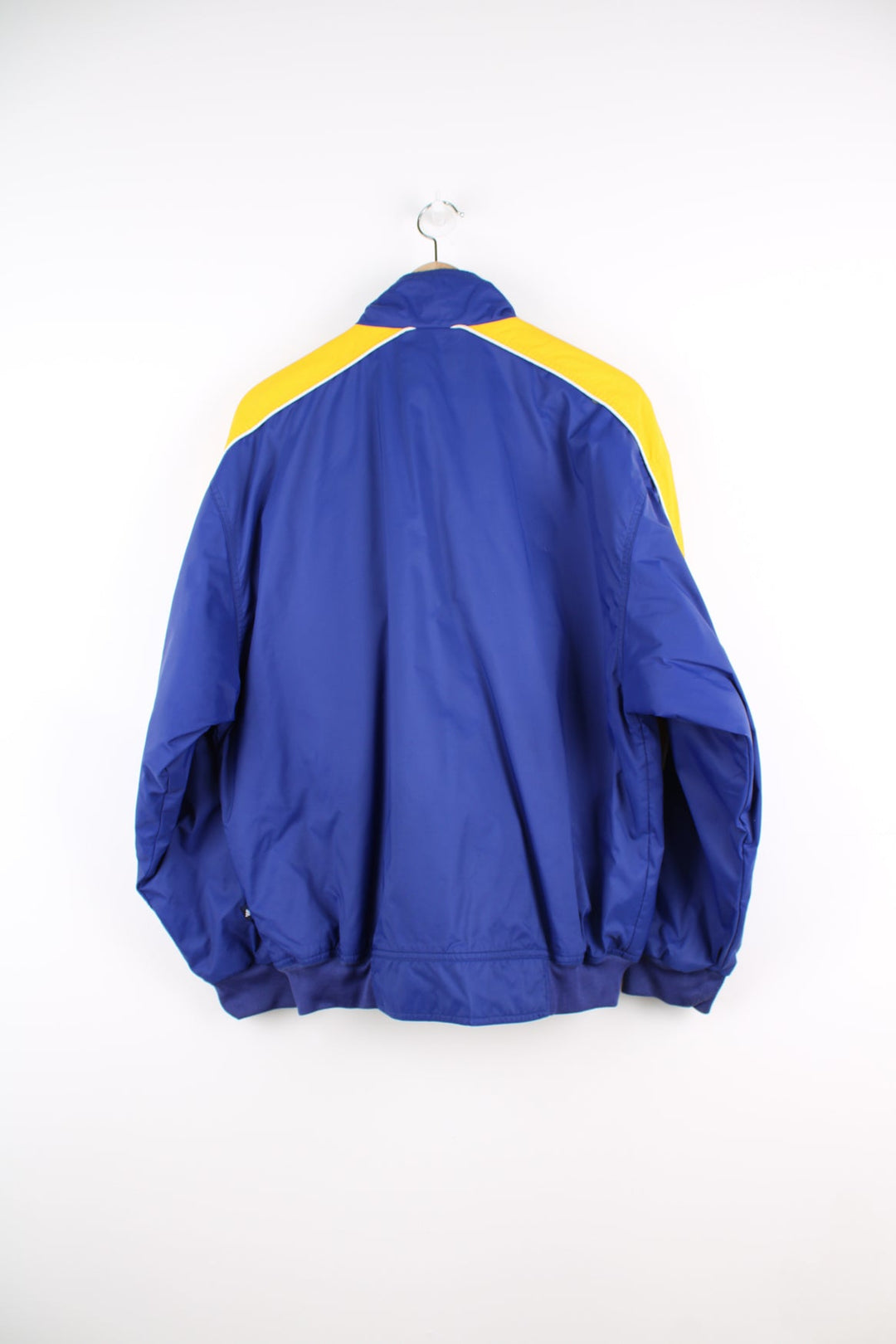 Vintage Adidas bomber style jacket in blue and yellow. Features embroidered logo on the chest.