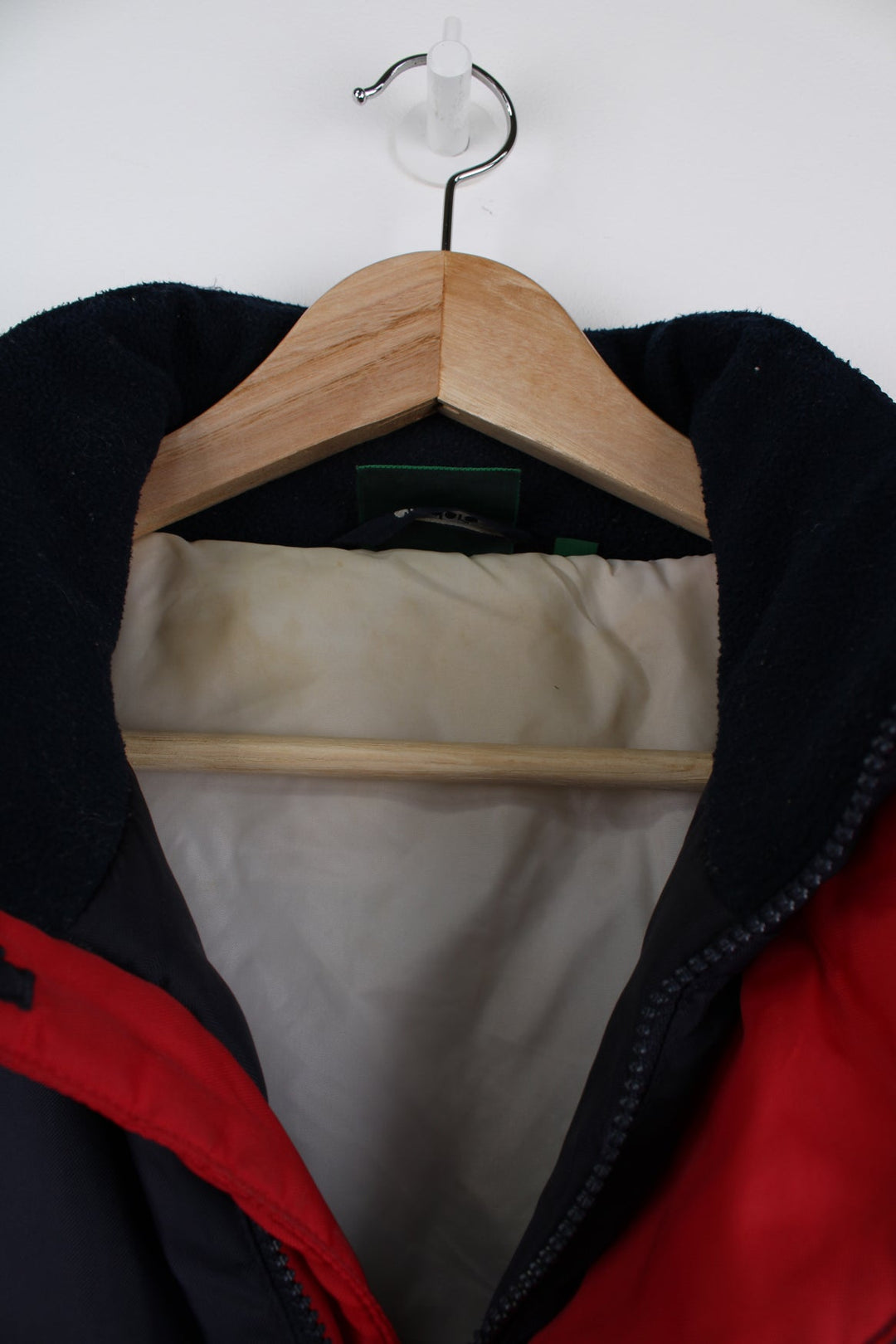 Vintage blue and red Diadora coat featuring embroidered logo on the front and back.