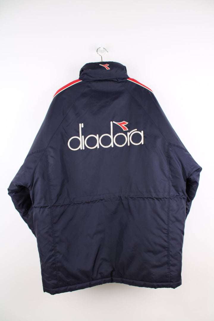 Vintage blue and red Diadora coat featuring embroidered logo on the front and back.