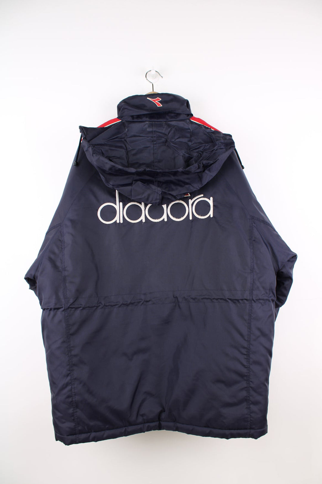 Vintage blue and red Diadora coat featuring embroidered logo on the front and back.