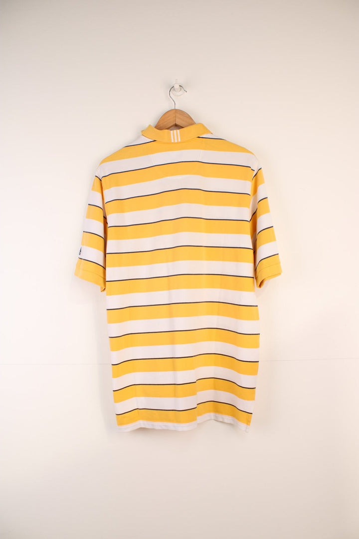 Adidas Climalite Polo Shirt in a yellow, black and white striped colourway, button up, and has logo embroidered on the left sleeve. 