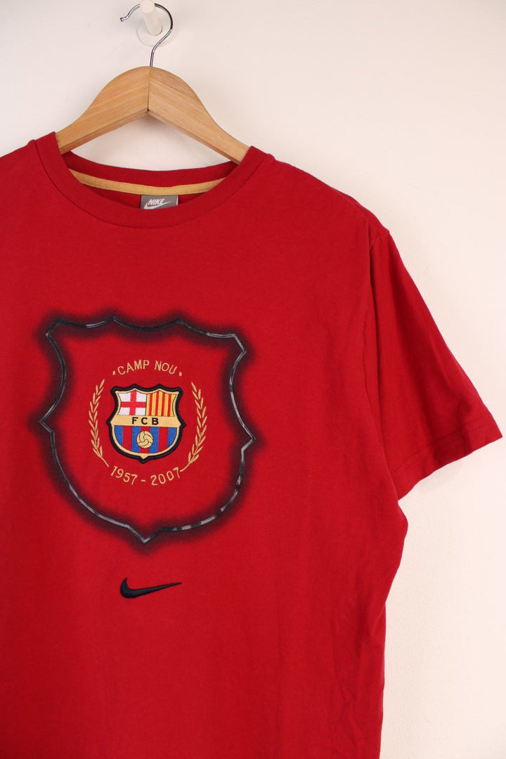 Nike Barcelona Football Team T-shirt in a red colourway, with the logos embroiderd on the front. 