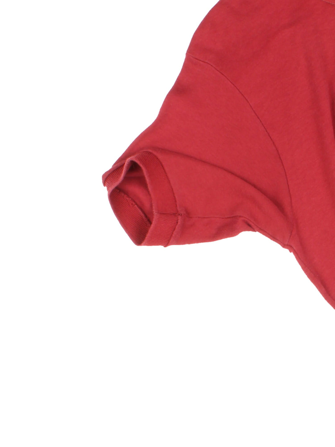 Vintage Lacoste by Izod Polo Shirt in a red colourway with button up collar and the logo embroidered on the front.