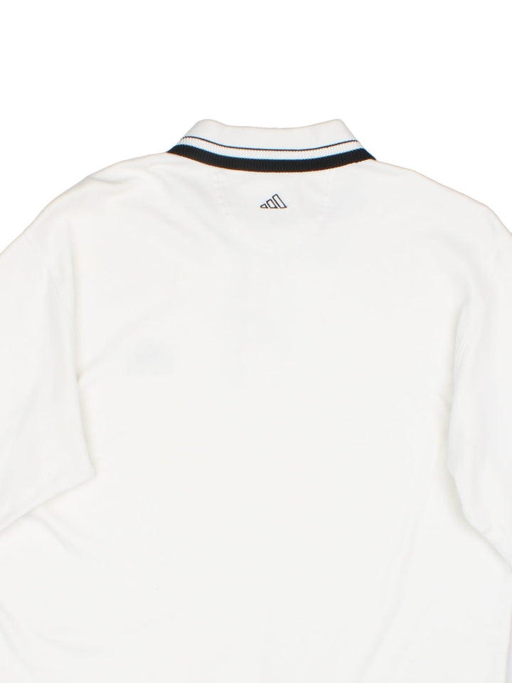 Adidas Golf Polo Shirt in a white and black colourway with a button up collar and the logo embroidered on the front and back.