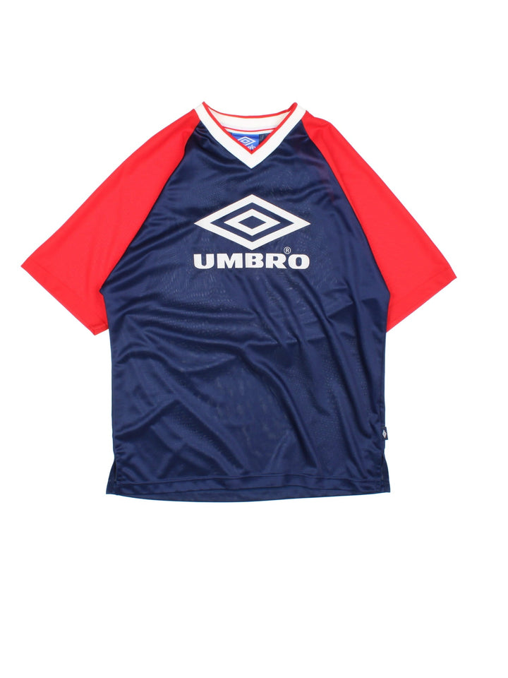 Vintage 90's Umbro Training Top in a blue and red colourway, v neck collar, has the logo and spell out embroidered on the front and on the back number 9 printed.