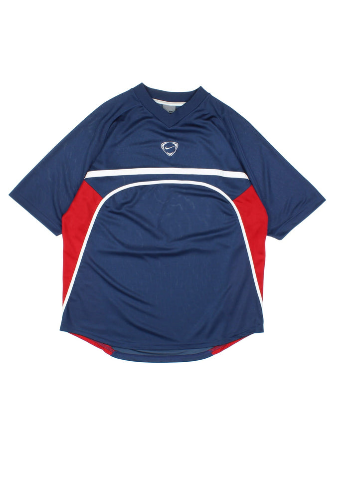 Vintage Y2K Nike Training Top in a blue, red and white colourway with the swoosh logo embroidered on the front and back.