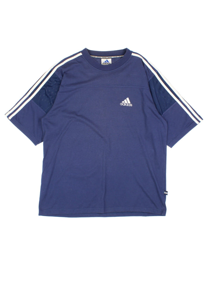 Vintage Adidas T-Shirt in a blue colourway, cotton t-shirt with part polyester mesh material on the sleeves, and has the logo embroidered on the front.