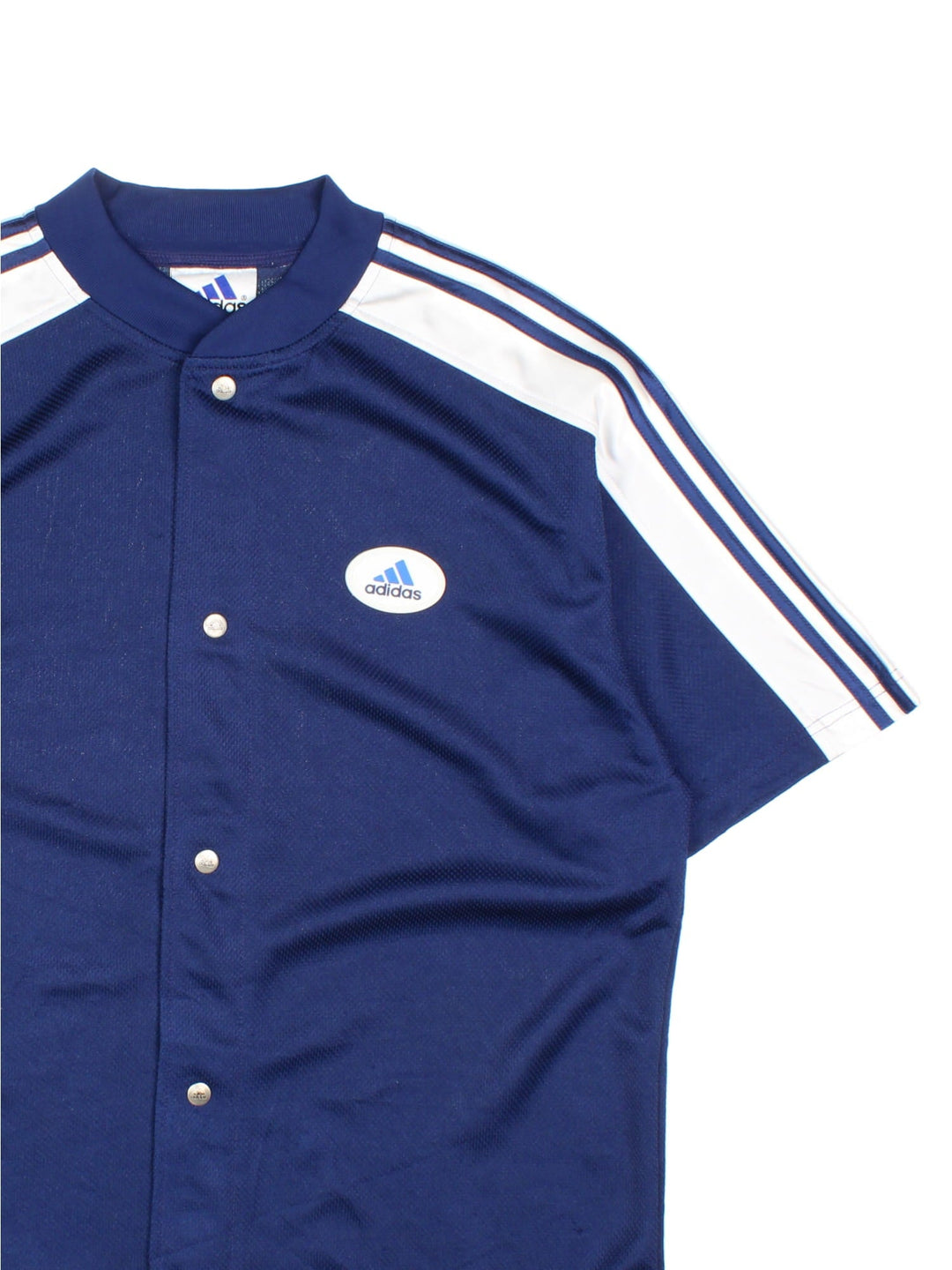 Vintage Adidas Snap Shooting Basketball Shirt in a blue and white colourway, snap button up, and has the logo badge embroidered on the front.